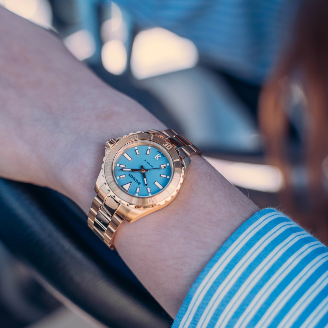 Lifestyle wrist shot of the Balmain Ophrys watch, showcasing its fresh rose gold PVD tones and elegant sporty design on a woman’s wrist.