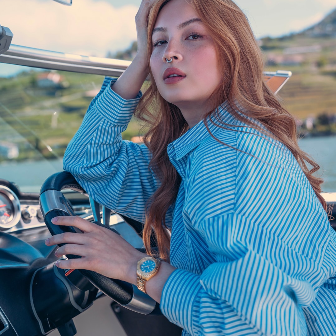 Lifestyle wrist shot of the Balmain Ophrys watch, showcasing its fresh rose gold PVD tones and elegant sporty design on a woman’s wrist.