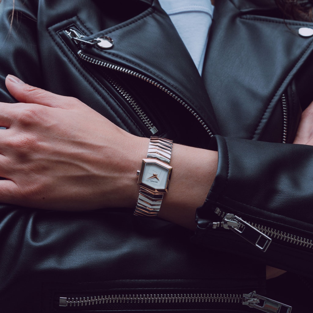 Lifestyle wrist shot of the Balmain Taffetas watch, showcasing its rose gold PVD tones and elegant sporty design on a woman’s wrist.