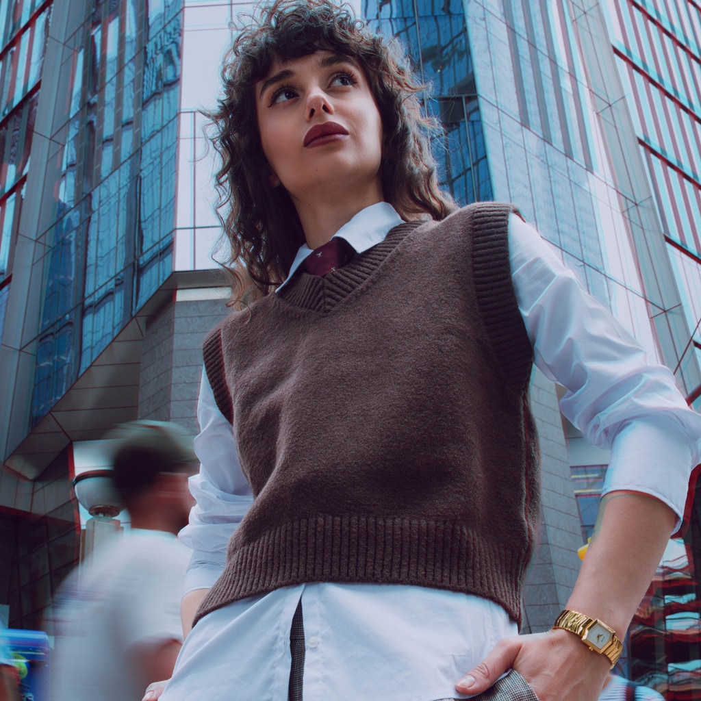 Lifestyle wrist shot of the Balmain Taffetas watch, showcasing its rose gold PVD tones and elegant sporty design on a woman’s wrist.