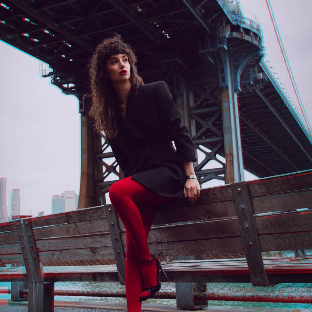 Lifestyle wrist shot of the Balmain Taffetas watch, showcasing its silver tones and elegant sporty design on a woman’s wrist.