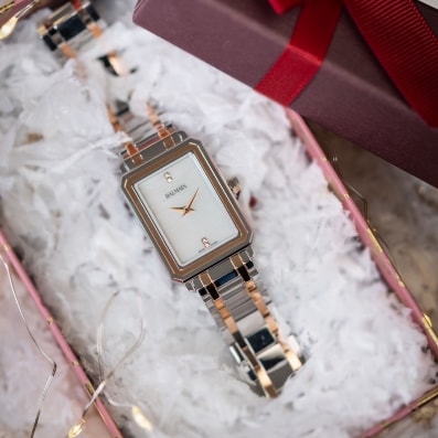 Close-up of Balmain festive collection watch featuring Parisian Haute Couture design