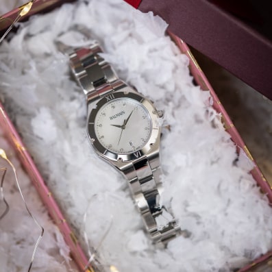 Close-up of Balmain festive collection watch featuring Parisian Haute Couture design