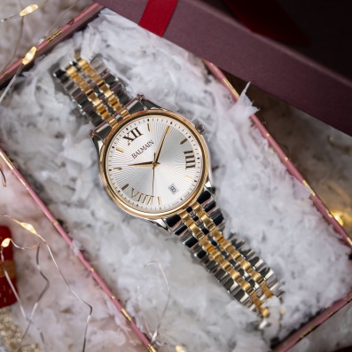 Close-up of Balmain festive collection watch featuring Parisian Haute Couture design