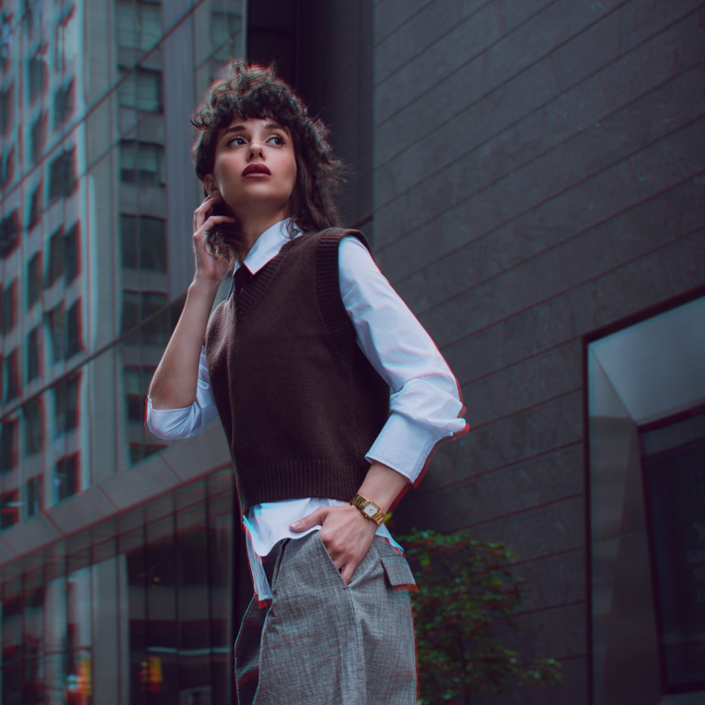 Lifestyle wrist shot of the Balmain Taffetas watch, showcasing its yellow gold PVD tones and elegant sporty design on a woman’s wrist.